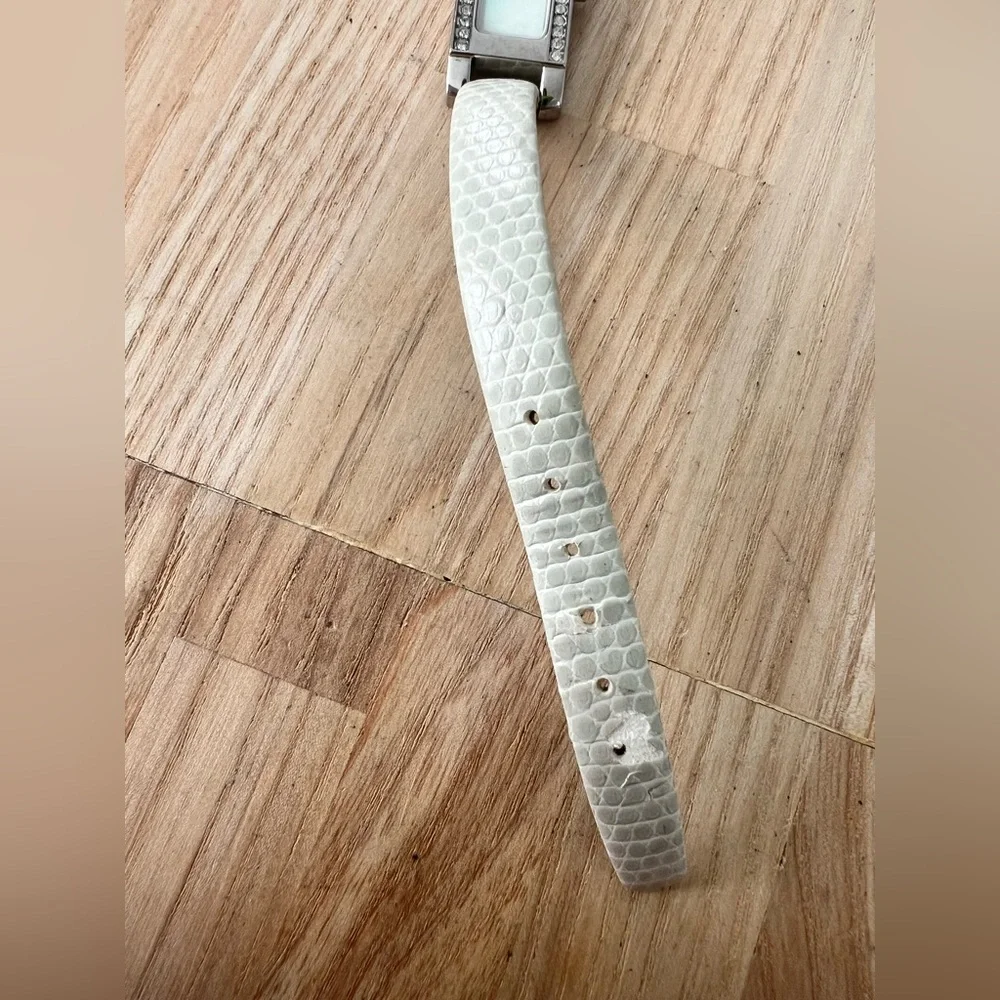 ESQ by Movado ladies skinny silver tone rectangular dress watch NEW BATTERY